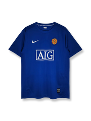 2006–07シーズンマンチェスター・ユナイテッドアウェイジャージ、ホワイトにグレーダイアゴナルストライプとブラックアクセントを配したモダンデザイン。