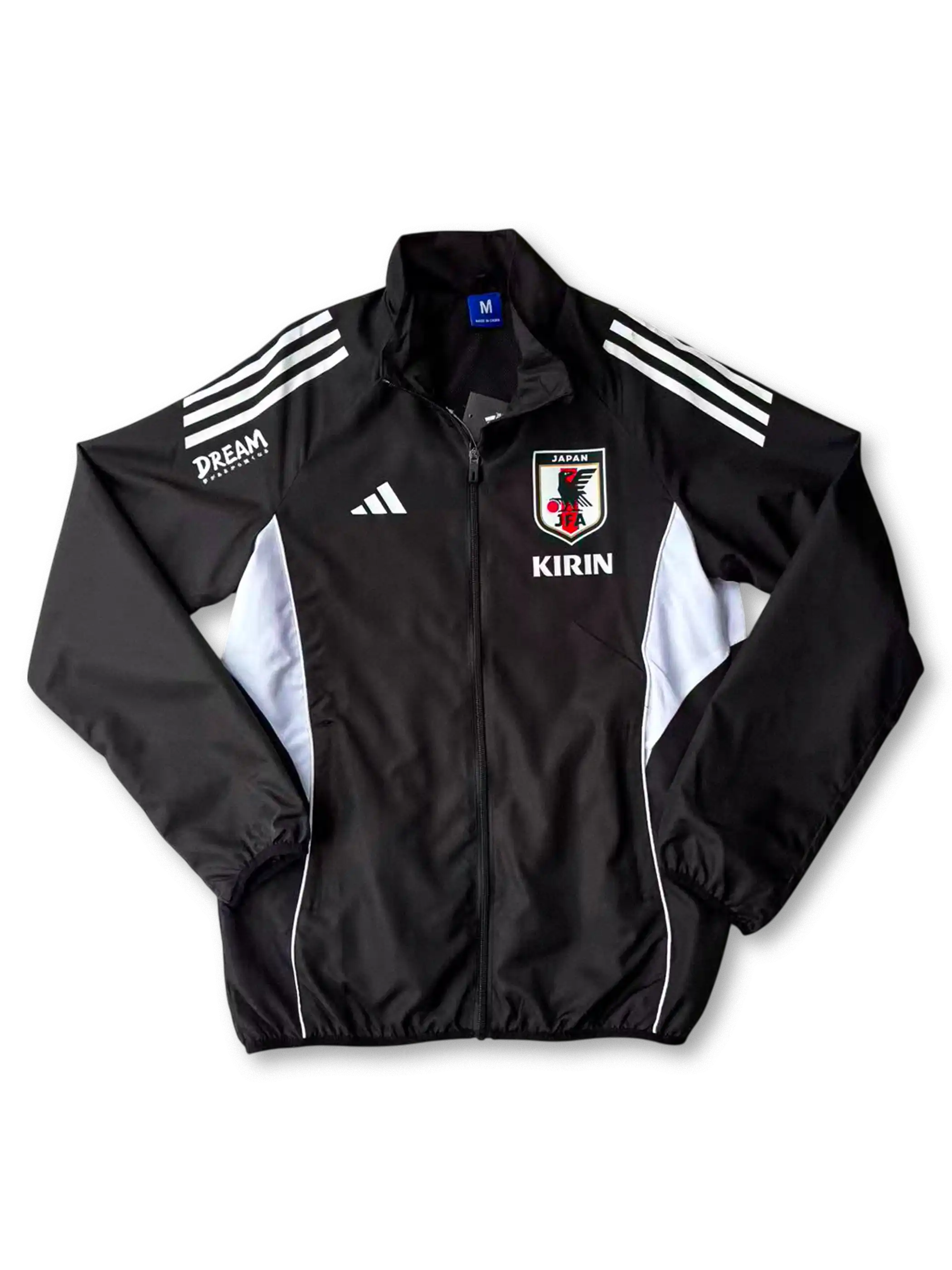 2025年日本代表トレーニングジャケット ブラック 正面、KIRINロゴとJFAエンブレム入りデザイン