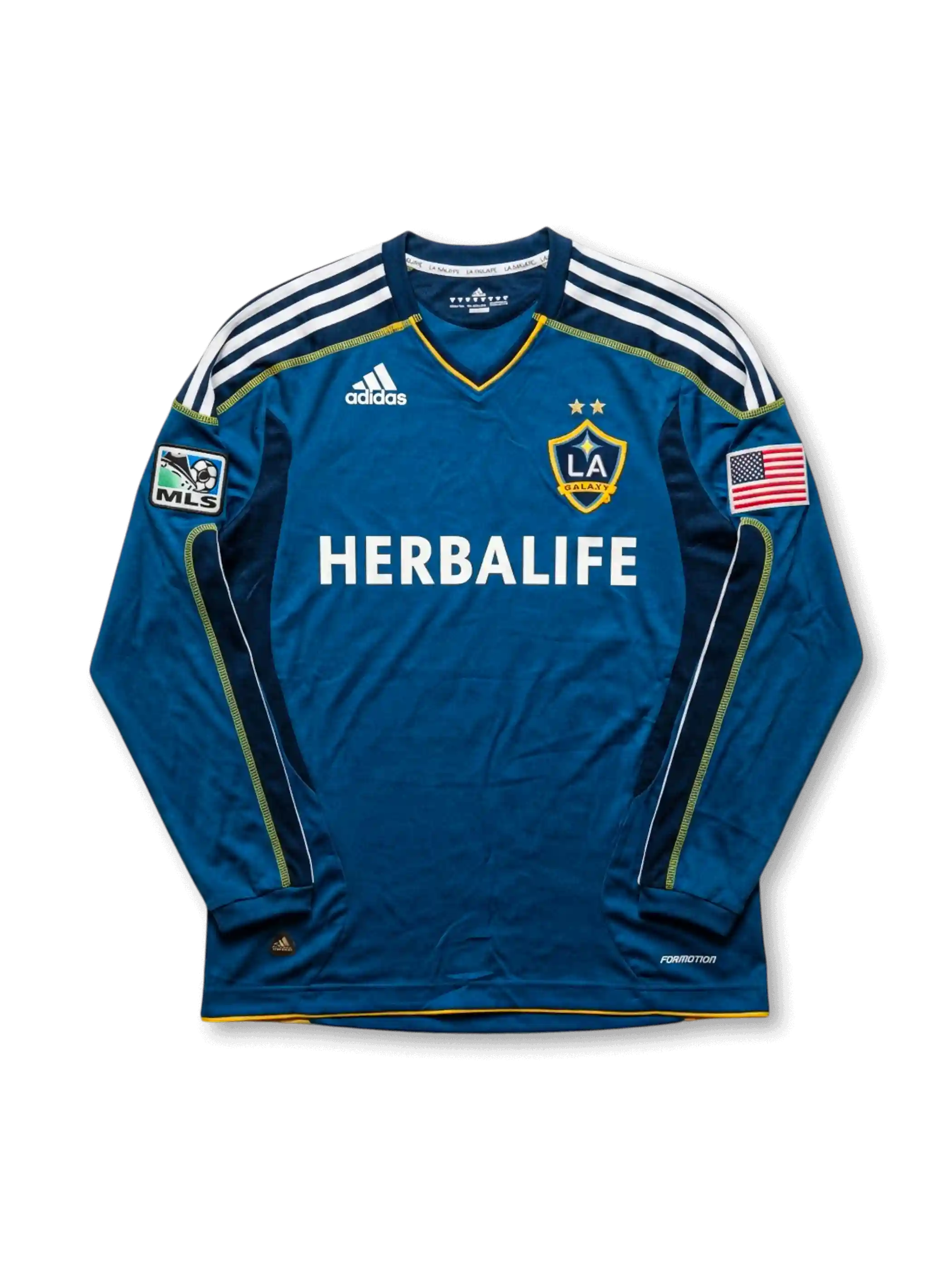 LAギャラクシー 2007-08 アウェイジャージの正面、ブルーボディ、HERBALIFEロゴ、LA Galaxyエンブレム、MLSパッチ、アメリカ国旗パッチ、白い肩ラインが見える長袖デザイン