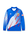 青を基調に白の斜めラインと赤の三角モチーフを配した1993年日本代表ホーム長袖ユニフォーム、左胸エンブレム、右袖の日本国旗パッチ、ポロカラー仕様、背面はネームと番号なし