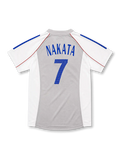 ライトグレーとホワイトの切り替え、ブルーの肩ライン、JFAエンブレム、背番号7を配した2002-04日本代表アウェイユニフォーム正面