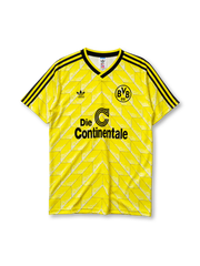 鮮やかなイエローの生地に白のシェブロン柄、黒地のVネック襟、左胸のadidasロゴ、右胸のBVB09クラブエンブレム、中央の黒いDie Continentaleスポンサーロゴを備えたボルシア・ドルトムント1988ホームジャージ正面