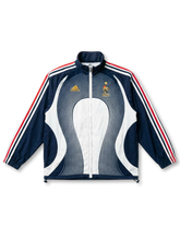 フランス代表 トラックジャケット ネイビー 同心円ウェーブ 2000年代 正面 — ネイビー×白同心円パネル、FFA雄鶏ゴールドエンブレム、トリコロール3ストライプ