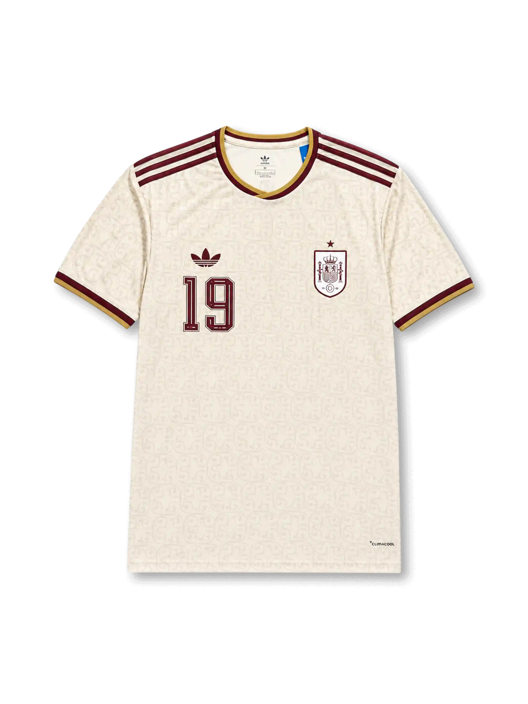 2026年スペイン代表ワールドカップアウェイユニフォーム正面、アイボリーホワイトボディ、同系色総柄、胸元スペイン代表エンブレム、ワインレッド背番号19、ワインレッド肩ストライプ、ゴールド襟トリム