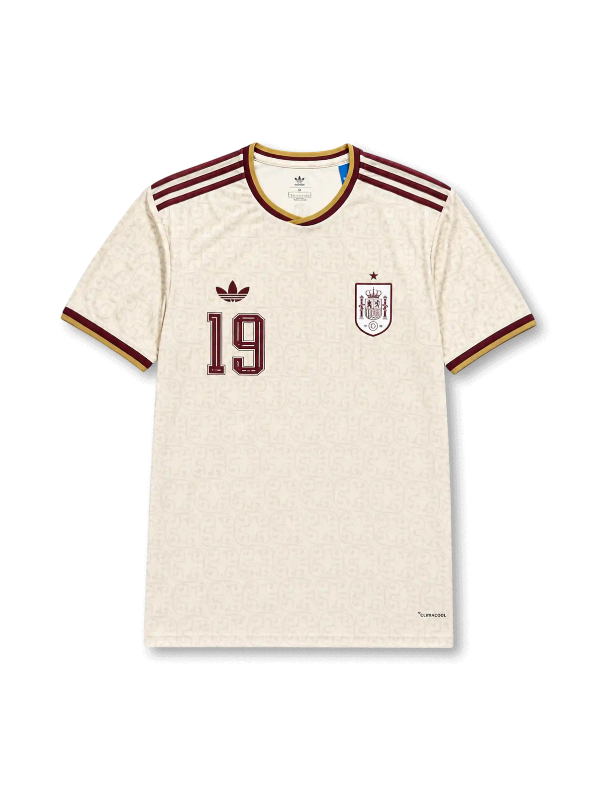 2026年スペイン代表ワールドカップアウェイユニフォーム正面、アイボリーホワイトボディ、同系色総柄、胸元スペイン代表エンブレム、ワインレッド背番号19、ワインレッド肩ストライプ、ゴールド襟トリム