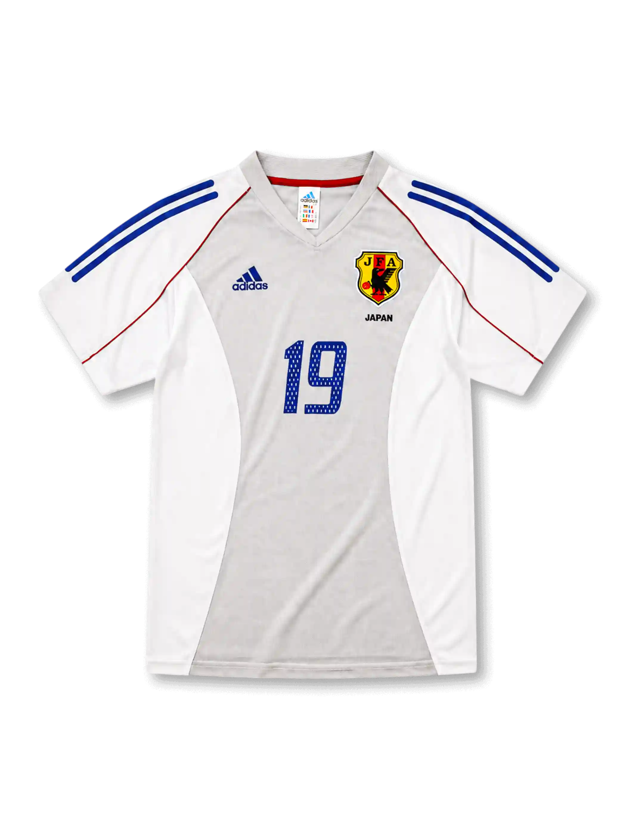 日本代表2002-04アウェイユニフォーム前面・ホワイト×グレーのパネル構成にブルーの2本ラインとレッドのパイピング、旧JFA八咫烏エンブレムとJAPAN表記、中央にブルーの背番号19