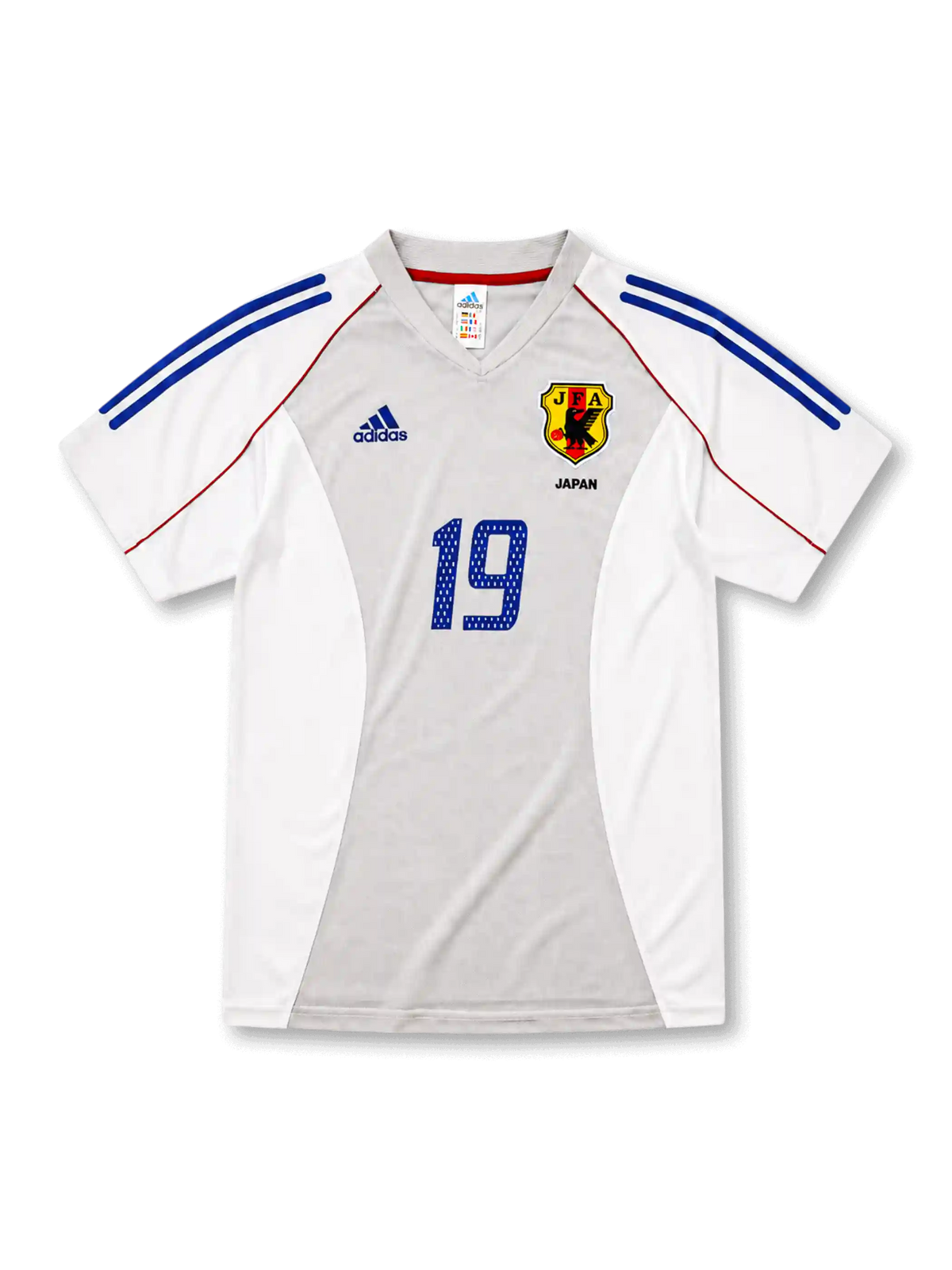 日本代表2002-04アウェイユニフォーム前面・ホワイト×グレーのパネル構成にブルーの2本ラインとレッドのパイピング、旧JFA八咫烏エンブレムとJAPAN表記、中央にブルーの背番号19