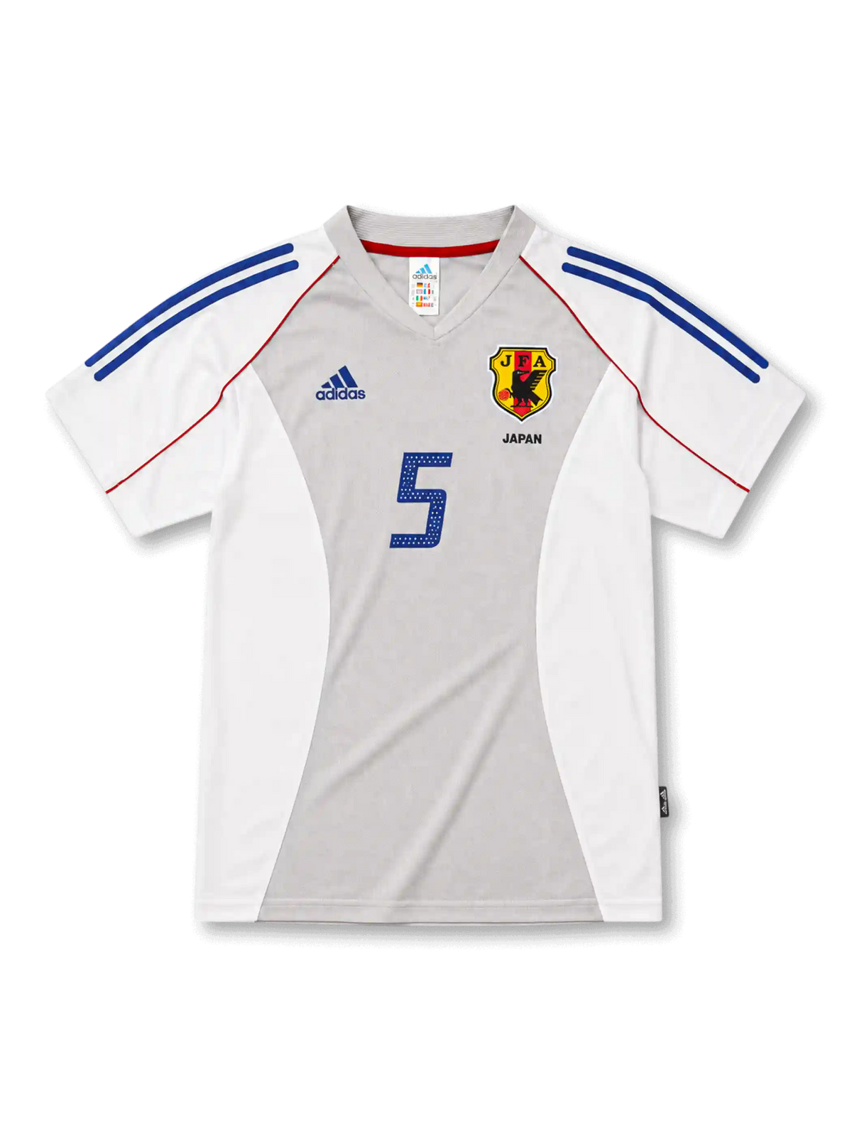 日本代表2002-04アウェイユニフォーム前面・ホワイト×グレーのパネル構成にブルーの2本ラインとレッドのパイピング、旧JFA八咫烏エンブレムとJAPAN表記、中央にブルーの背番号5