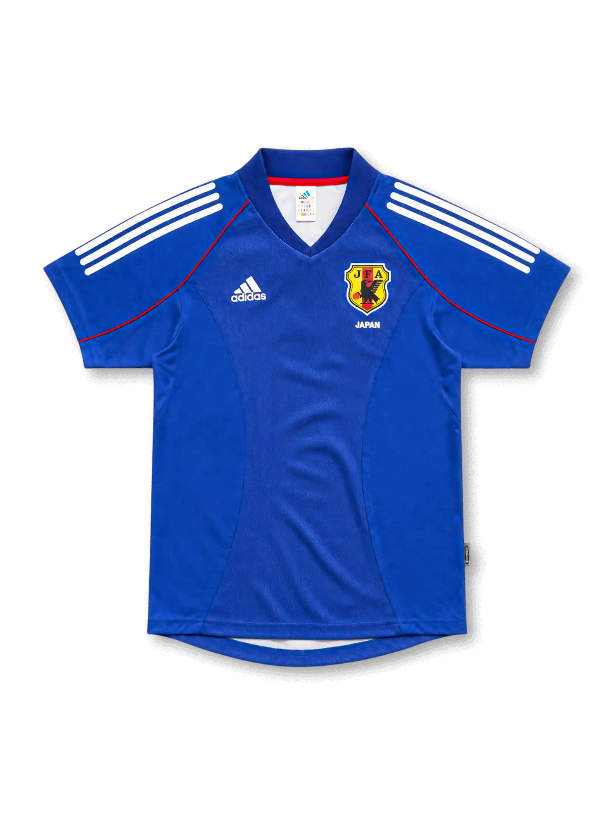 2002年日本代表ホームユニフォーム、鮮やかな青地に白い肩ライン、赤いパイピング、JFAエンブレムを配した半袖デザイン。