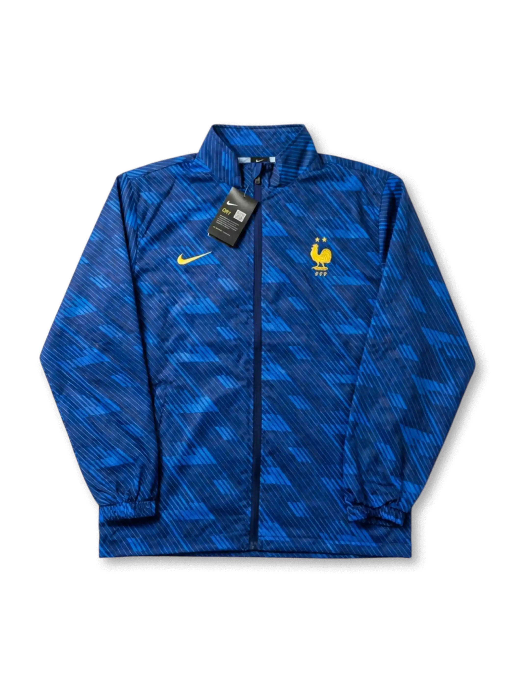 フランス代表×Nikeウィンドブレーカートレーニングジャケット正面・ブルー幾何学柄、ロイヤルブルー幾何学カモフラージュ総柄・ゴールドNikeスウッシュ・2星FFFエンブレム・タグ付き未使用