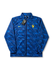 フランス代表×Nikeウィンドブレーカートレーニングジャケット正面・ブルー幾何学柄、ロイヤルブルー幾何学カモフラージュ総柄・ゴールドNikeスウッシュ・2星FFFエンブレム・タグ付き未使用
