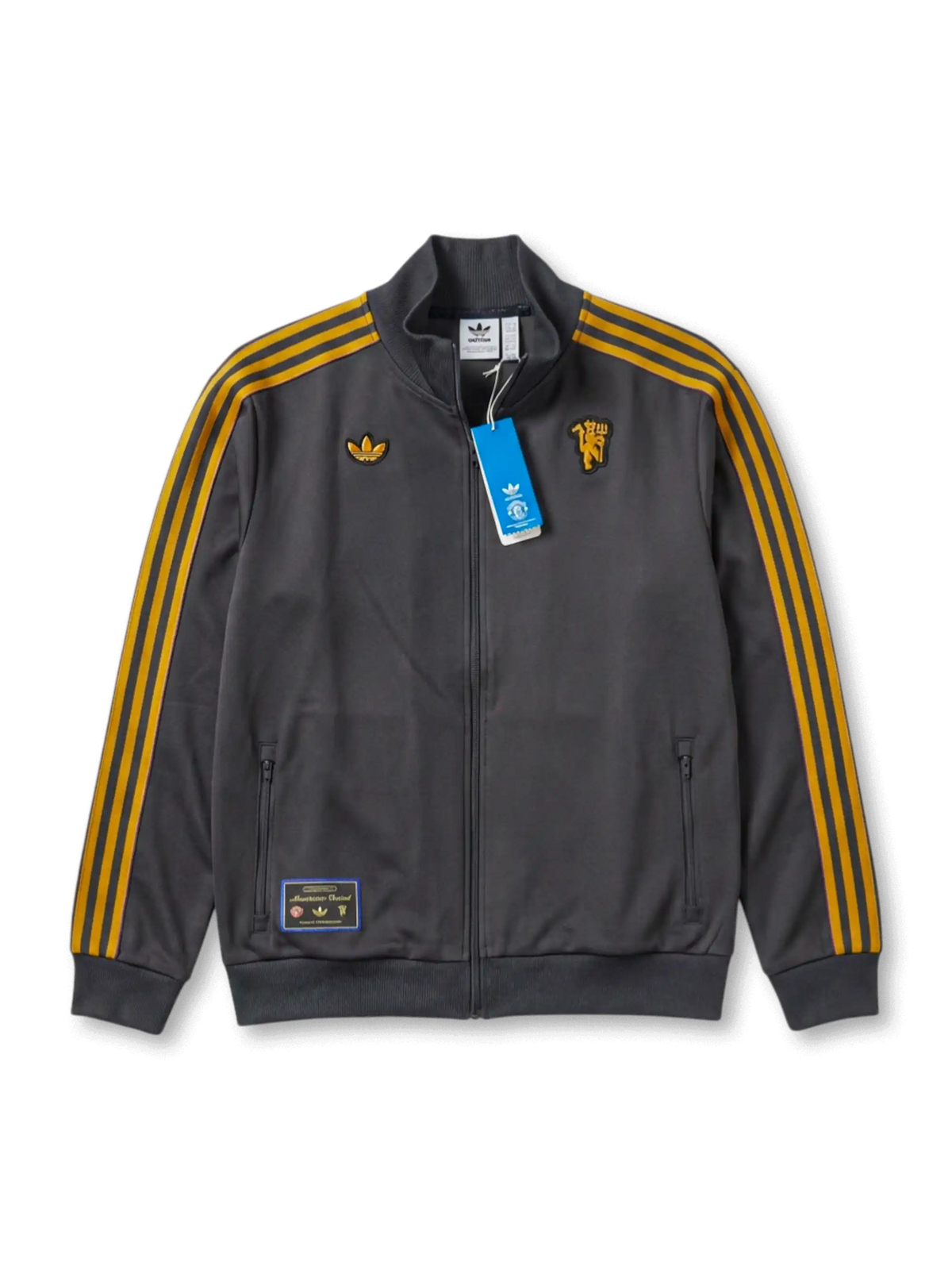マンチェスター・ユナイテッド adidas Originals 復刻トラックジャケット チャコール — ゴールドストライプとヴィンテージエンブレムを配したライフスタイルライン