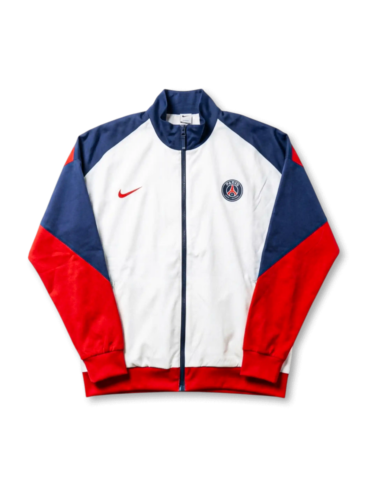 パリ・サンジェルマン Nike トラックジャケット ホワイト/ネイビー/レッド — 三色切替パネルとPSG現行円形エンブレム刺繍を配した公式トレーニングライン